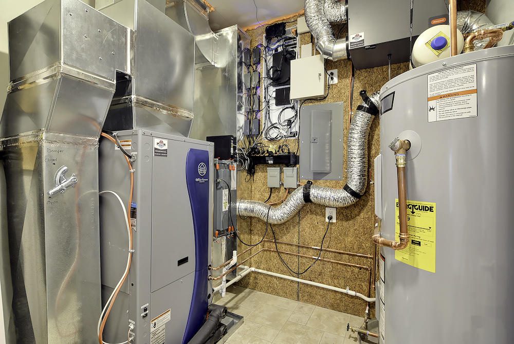 Finished furnace and air handler in a mechanical room